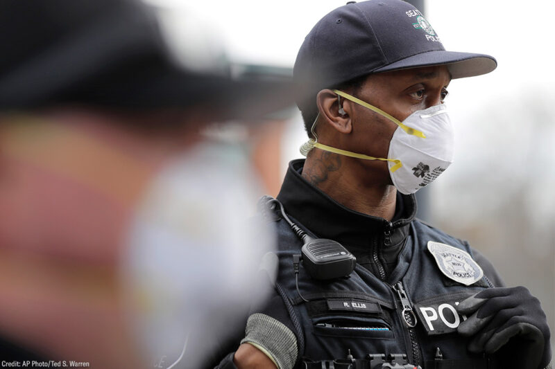 Two Seattle police officers wearing N95 masks.