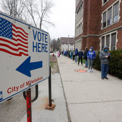 Voters line up outside of a polling station in Milwaukee for Wisconsin's primary election.