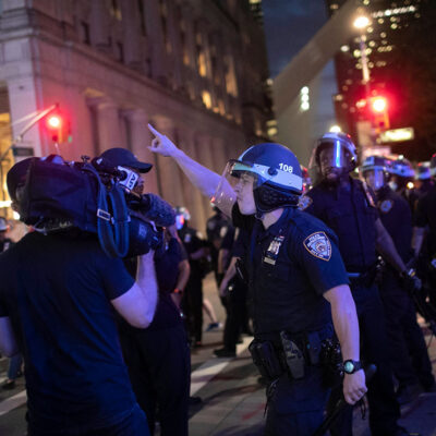 A police officer shouts at Associated Press videojournalist Robert Bumsted, Tuesday, June 2, 2020, in New York.