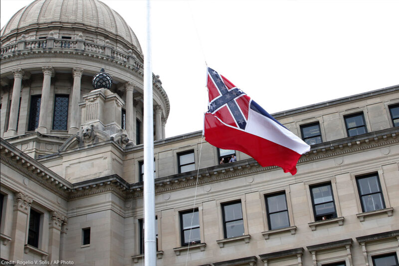 The retired Mississippi state flag is raised over the Capitol grounds one final time in Jackson, Mississippi