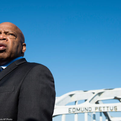Rep. John Lewis stands on the Edmund Pettus Bridge in Selma, Alabama. The late representative was beaten by police on the bridge on "Bloody Sunday" on March 7, 1965.