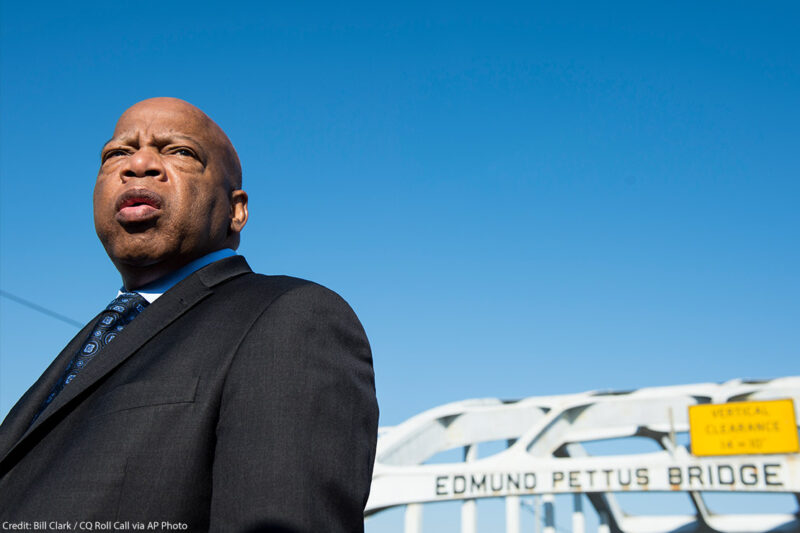 Rep. John Lewis stands on the Edmund Pettus Bridge in Selma, Alabama. The late representative was beaten by police on the bridge on "Bloody Sunday" on March 7, 1965.