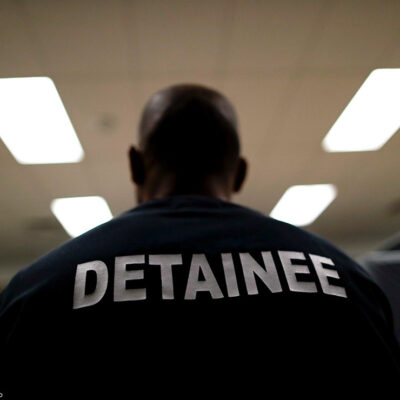 A detainee sits at the Otay Mesa Detention Center in San Diego.