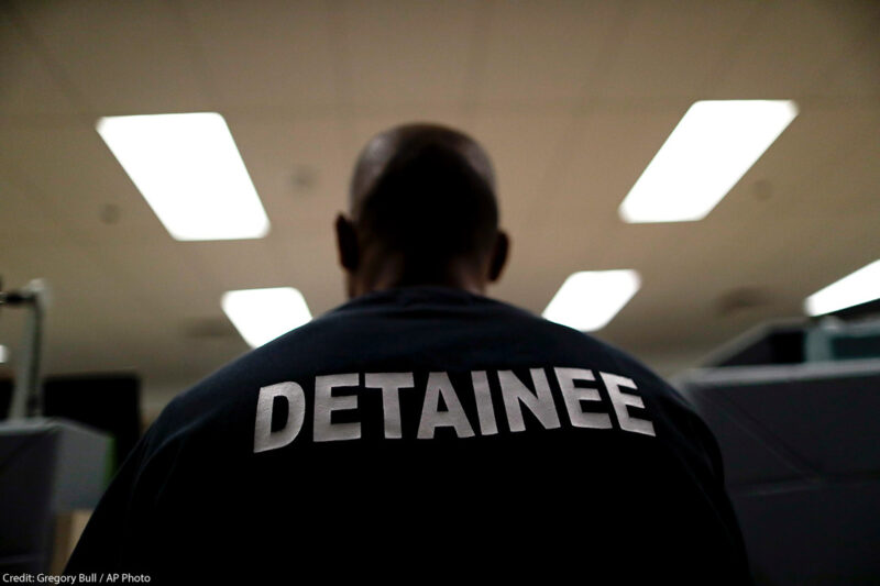 A detainee sits at the Otay Mesa Detention Center in San Diego.