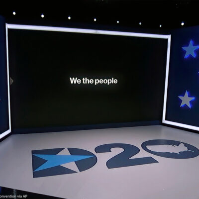 The set in Los Angeles during the first night of the Democratic National Convention. "We the People" can be read on the monitor.