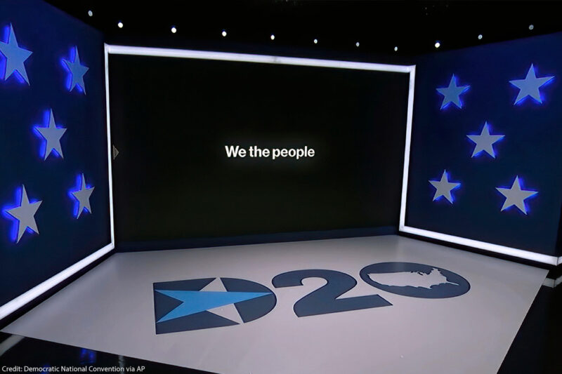 The set in Los Angeles during the first night of the Democratic National Convention. "We the People" can be read on the monitor.