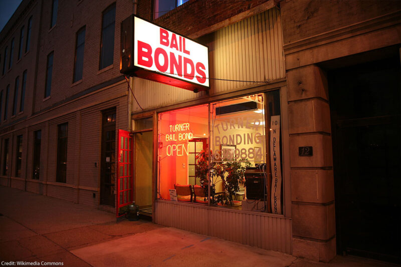 Photo of a bail bonds shop at night.