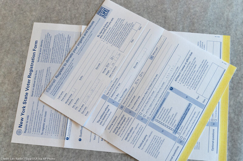 Photo from above of New York State Voter registration forms