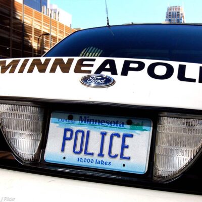 A Minneapolis, MN, police car rear license plate is shown that says "POLICE"