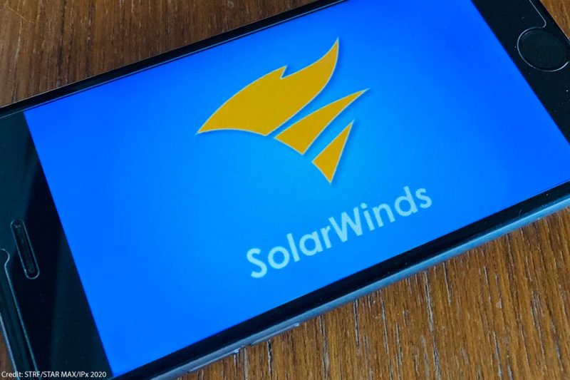 The logo of SolarWinds is seen on a phone screen