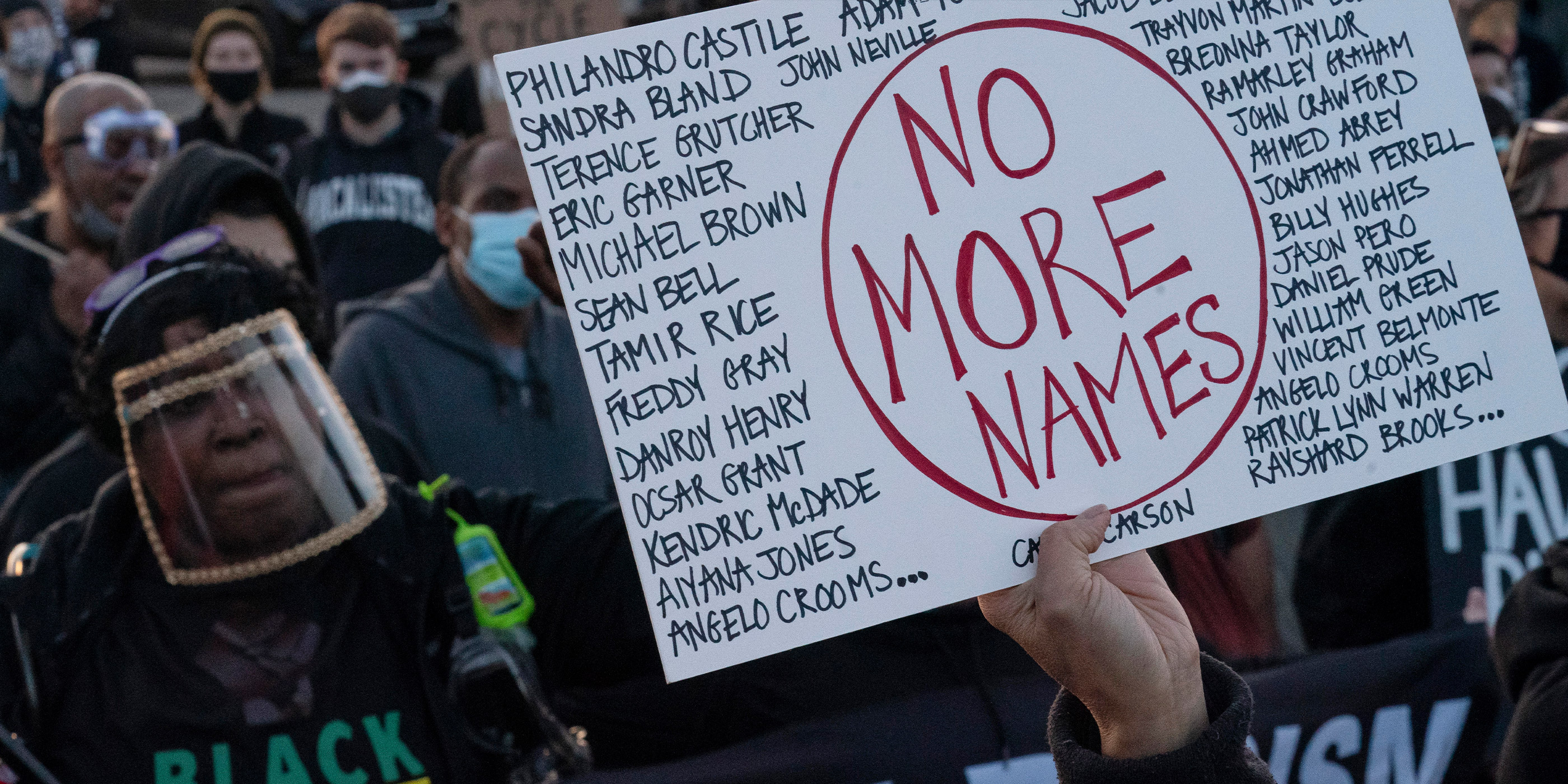 Protestor holds sign that reads "No More Names" in regards to black people who have been murdered by police