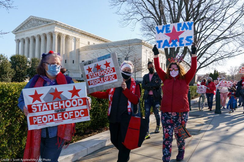 Advocates for statehood for the District of Columbia rally near the Supreme Court and Capitol prior to a House of Representatives hearing on creating a fifty-first state, in Washington, Monday, March 22, 2021.