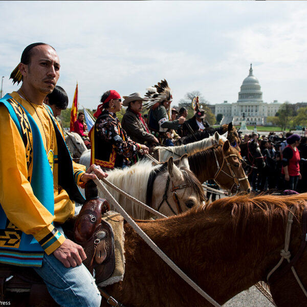 Native Americans on horse back protesting at Capitol Hill