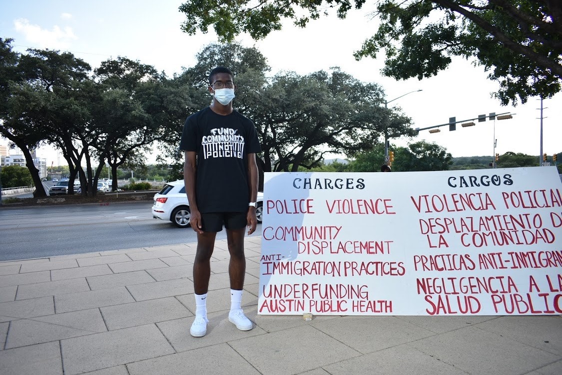 Aaron Booe poses for a picture at a demonstration in Austin, Texas.