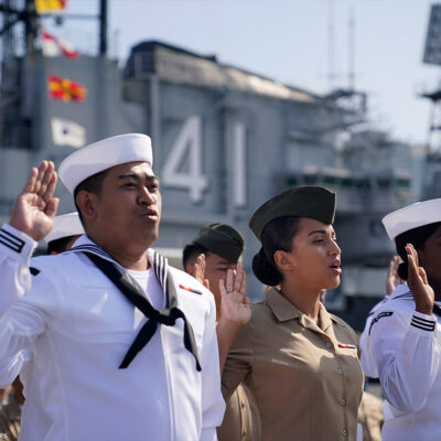 United States Navy sailors and Marines from ten different countries take an oath of citizenship during a ceremony for members of the military aboard the USS Midway Museum Friday, July 2, 2021, in San Diego.