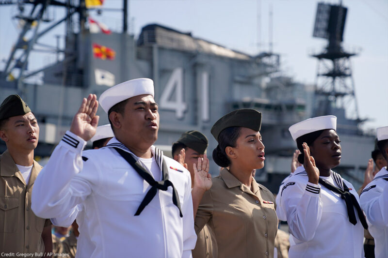 United States Navy sailors and Marines from ten different countries take an oath of citizenship during a ceremony for members of the military aboard the USS Midway Museum Friday, July 2, 2021, in San Diego.