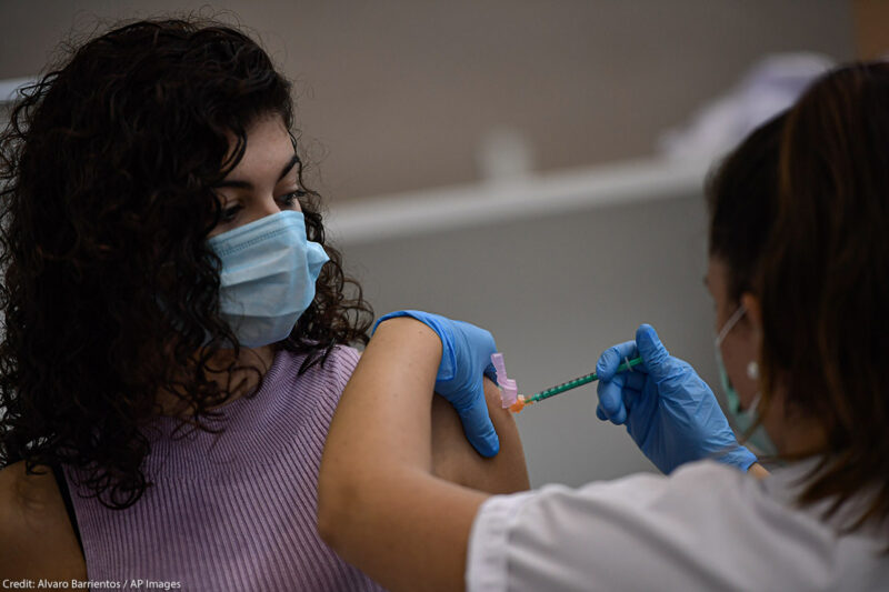 A woman receives the Pfizer COVID-19 vaccine, Thursday, Sept. 2, 2021.