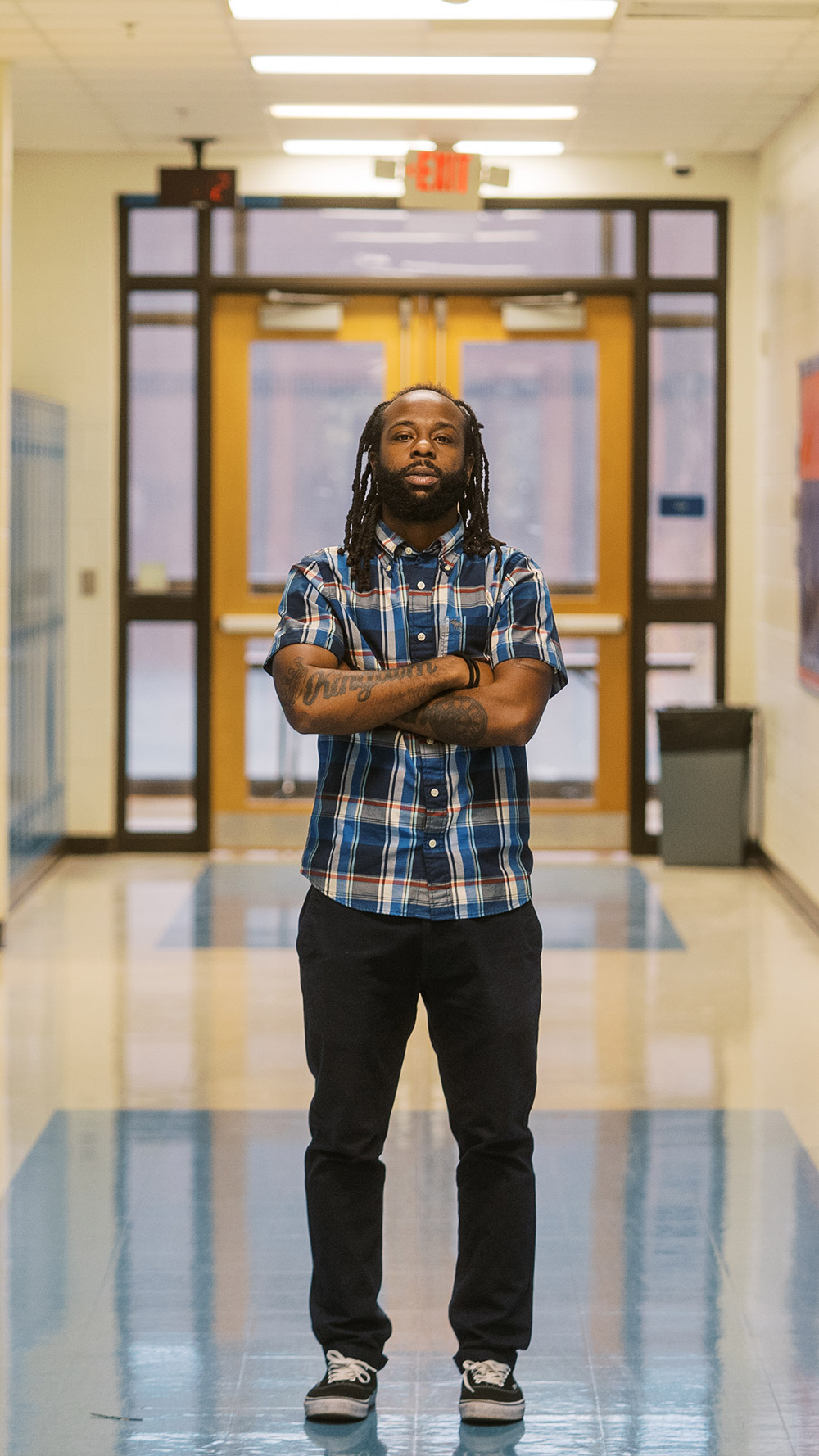 Anthony, a teacher profiled in this blog, stands in the middle of his school's hallway