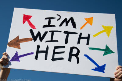 A protest sign that reads, "I'm With Her"