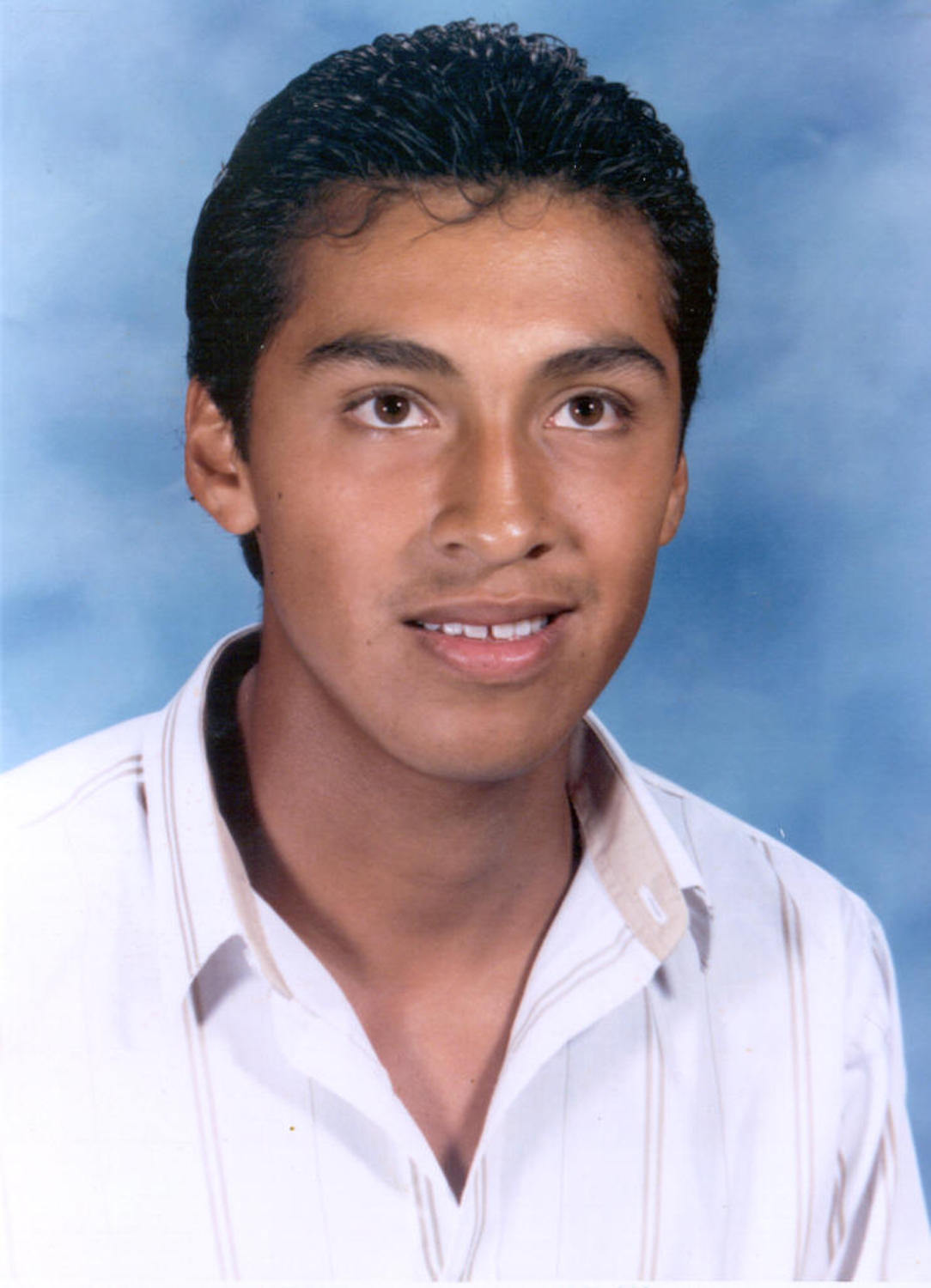 A school photo of Efren Paredes, the author, at 15 years old.