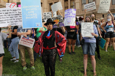 Demonstrators with pro-abortion-and-LGBTQ signage.