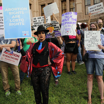 Demonstrators with pro-abortion-and-LGBTQ signage.