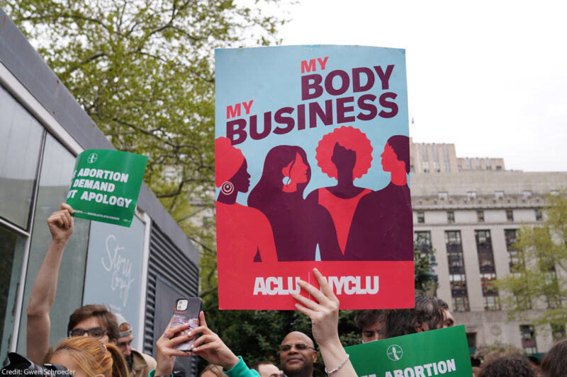 A protest sign that reads “My Body, My Business.”