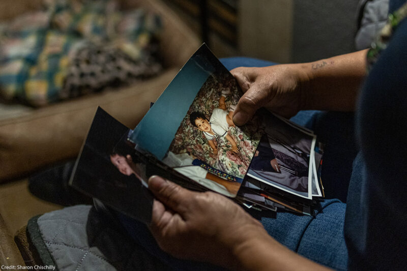 An ACLU client looking at family photos.