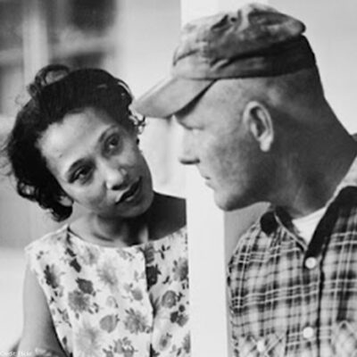 A photo of Mildred and Richard Loving looking at each other.