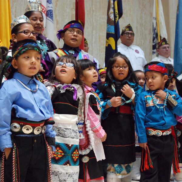 Children from the Zuni Pueblo lead the U.S. pledge of allegiance in the Zuni language in the New Mexico state Capitol in Santa Fe, N.M.