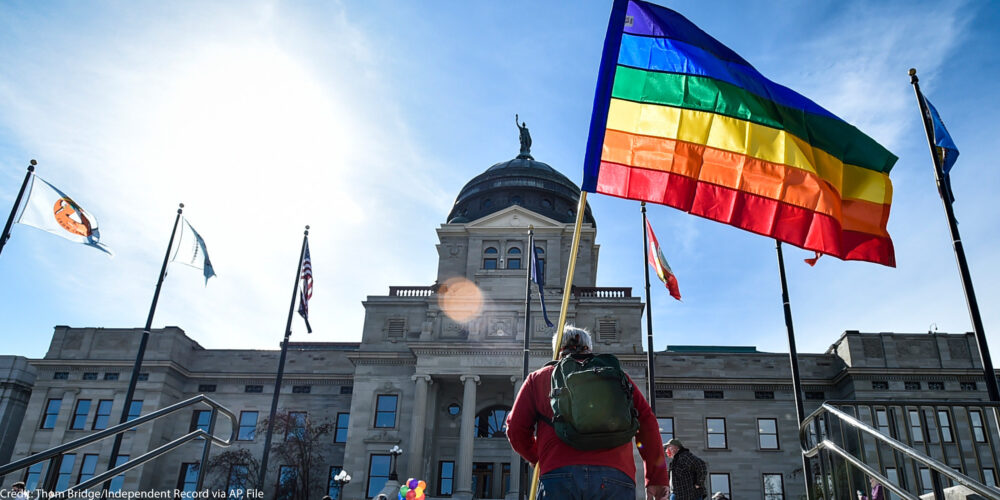 Demonstrators gather on the steps of the Montana State Capitol protesting anti-LGBTQ+ legislation.