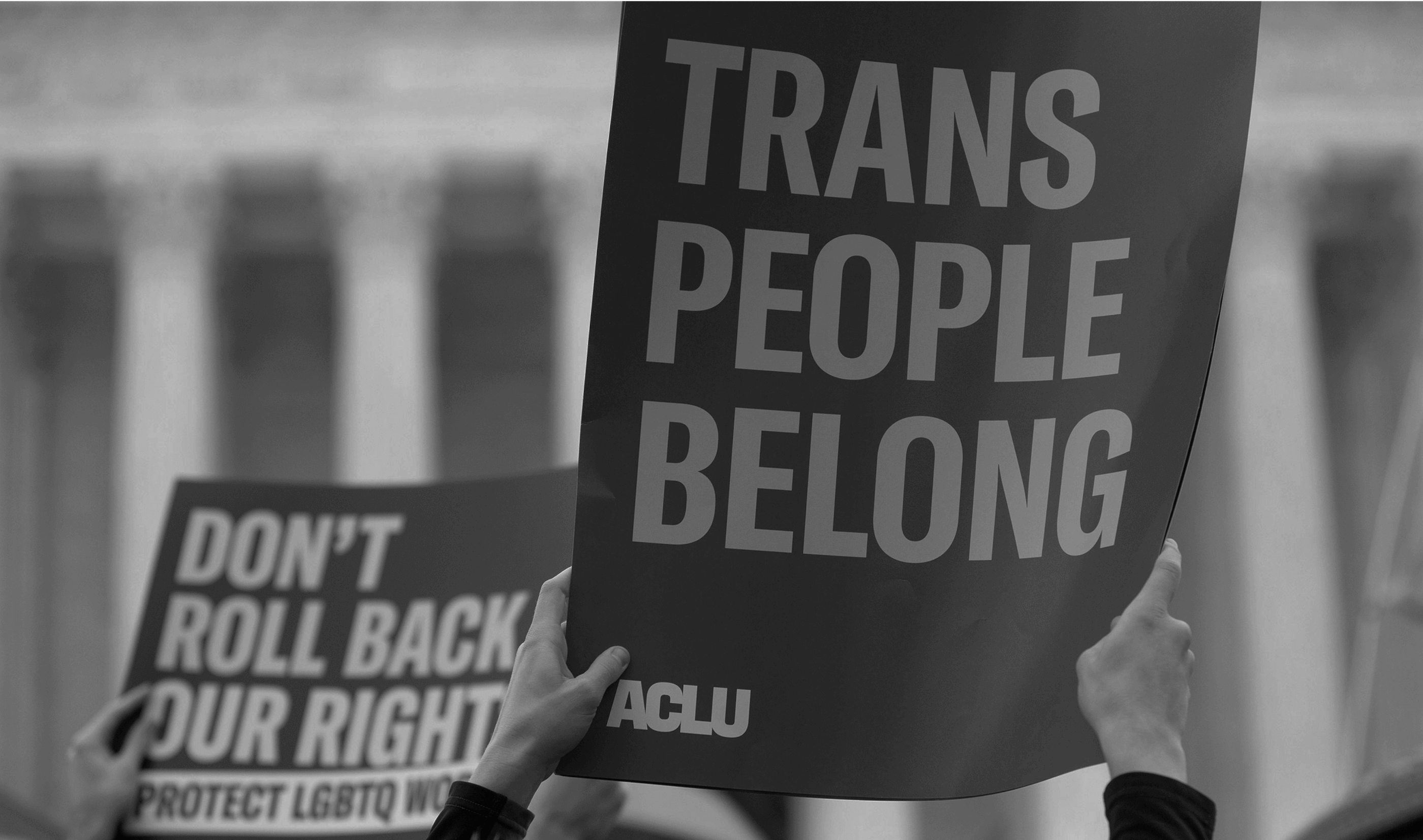 A sign that reads Trans People Belong