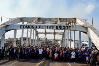 Demonstrators including Vice President Kamala Harris march on the Edmund Pettus Bridge on the anniversary of "Bloody Sunday" on Sunday, March 6, 2022.