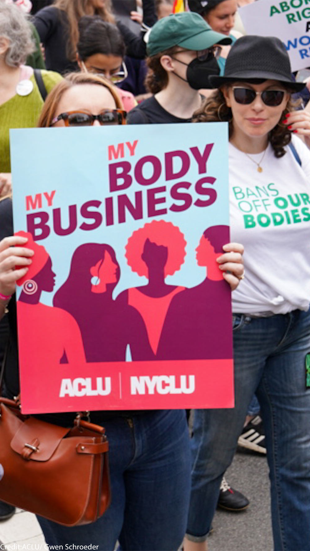ACLU supporters marching at a reproductive rights rally.