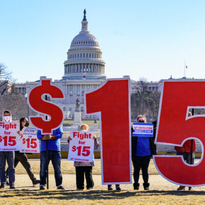 Activists appeal for a $15 minimum wage near the Capitol in Washington.