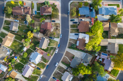 Aerial view of a line of houses on a suburban street
