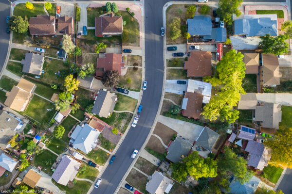 Aerial view of a line of houses on a suburban street