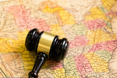 A map of the United States with a gavel on it.