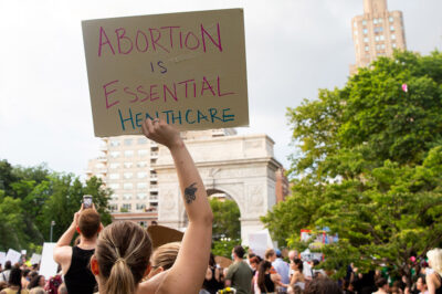 Protest sign that reads "abortion is essential healthcare"
