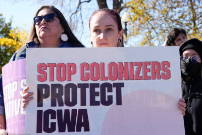 Demonstrators stand outside the US Supreme Court to hear decisions over Indian Child Welfare Act.