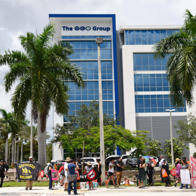 Protestors march in front of the ICE Company, The Geo Group building, demanding the end of private prisons.
