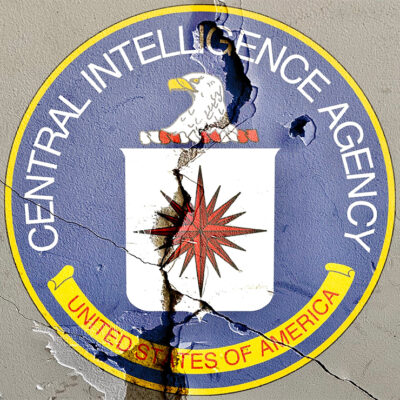 CIA logo on cracked wall.